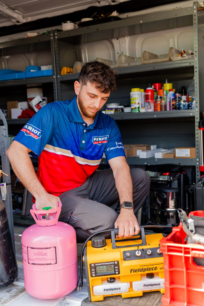 Patriot Heating, Air and Fuel Oil service worker getting ready to perform heater maintenance in Bristol, PA