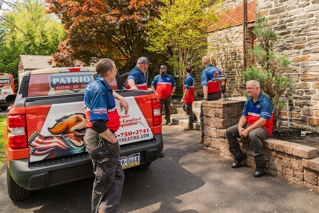 Patriot Heating, Air and Fuel Oil service workers after completing HVAC service at a Bristol, PA home
