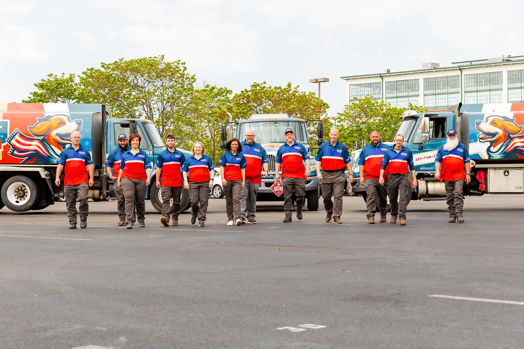 Patriot Heating, Air and Fuel Oil's HVAC services crew in walking in front of branded vehicles and ready to serve Feasterville and Trevose