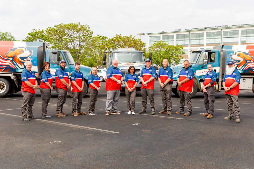 a group photo of Patriot Heating, Air and Fuel Oil’s Feasterville-Trevose HVAC services crew standing in front of branded vehicles