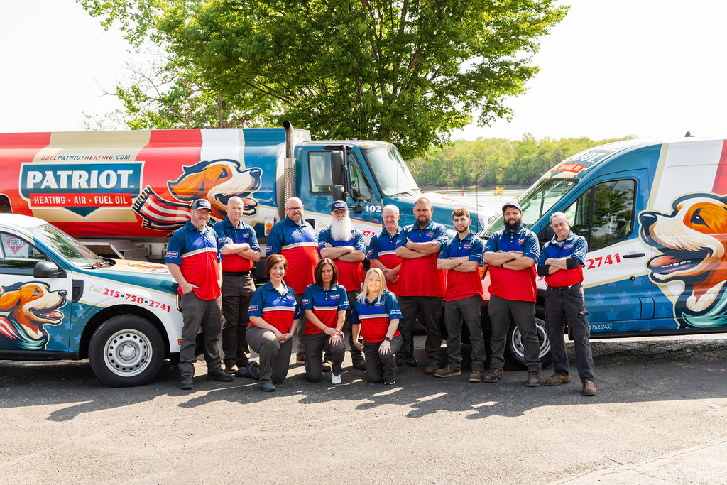 Torresdale, PA, HVAC services crew from Patriot Heating, Air and Fuel Oil standing in front of branded vehicles
